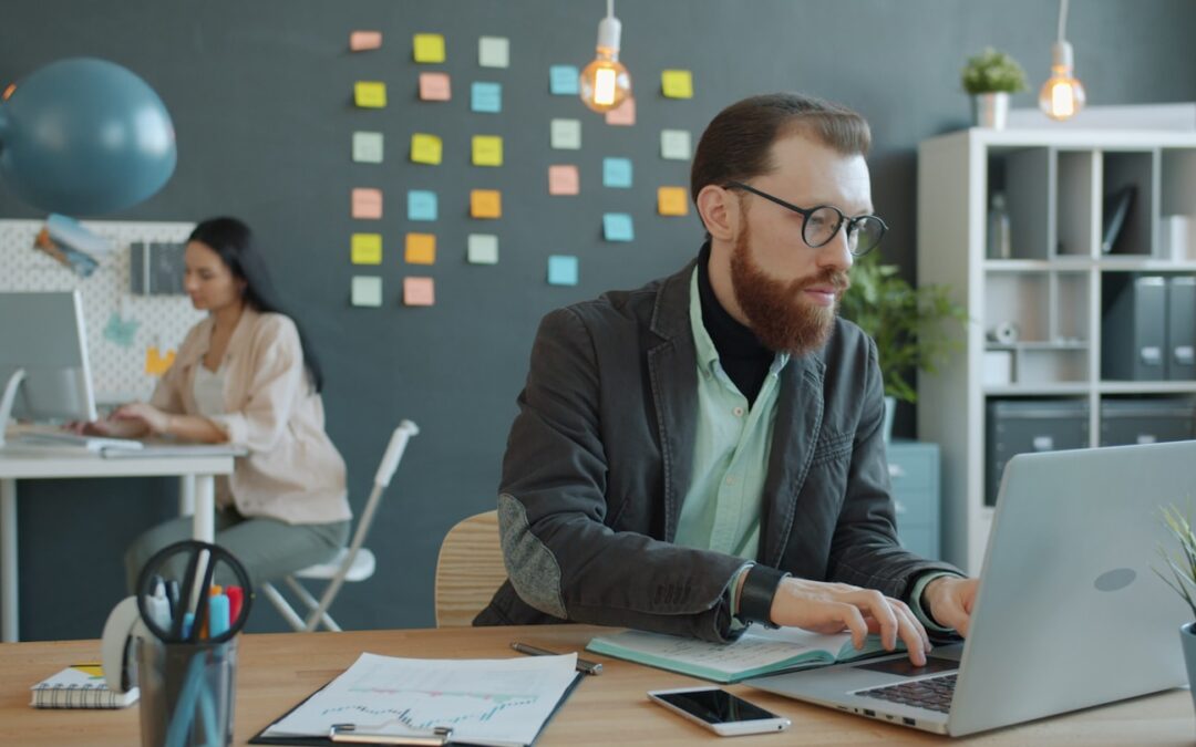 Man and woman working in modern office setting